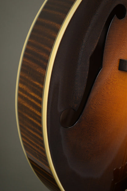 Flame maple rim and f-hole detail on the Big Mon mandolin's lower bout