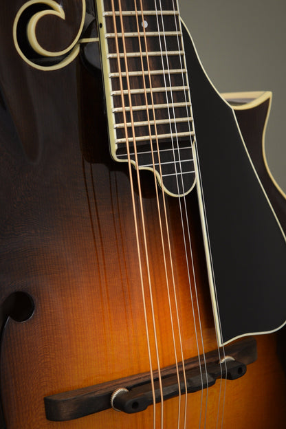 Black pickguard, fingerboard extension, and ebony bridge on the Big Mon mandolin