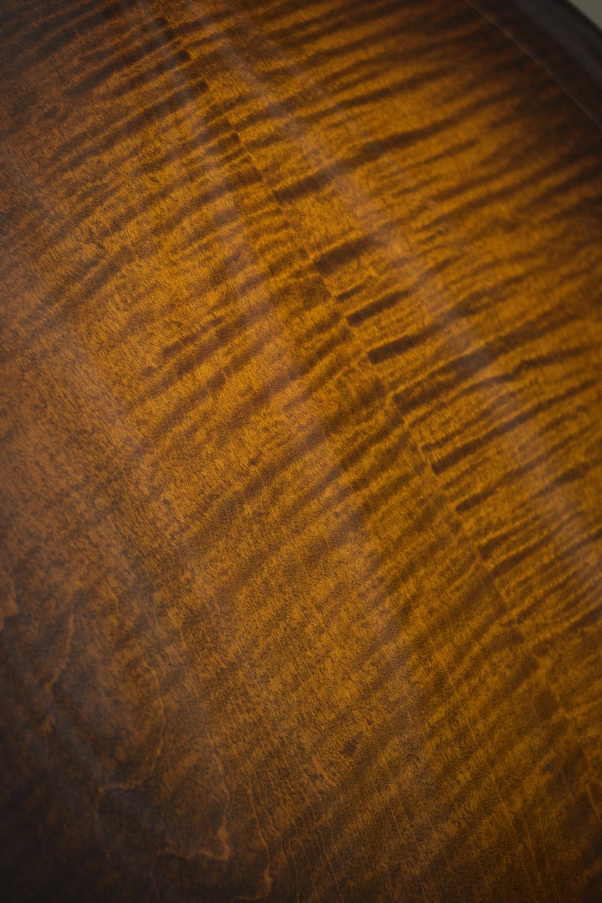 Close-up of the flame maple figure on the Big Mon mandolin's back