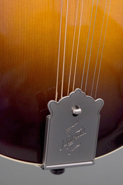 Engraved Northfield tailpiece and lower top of the Big Mon mandolin