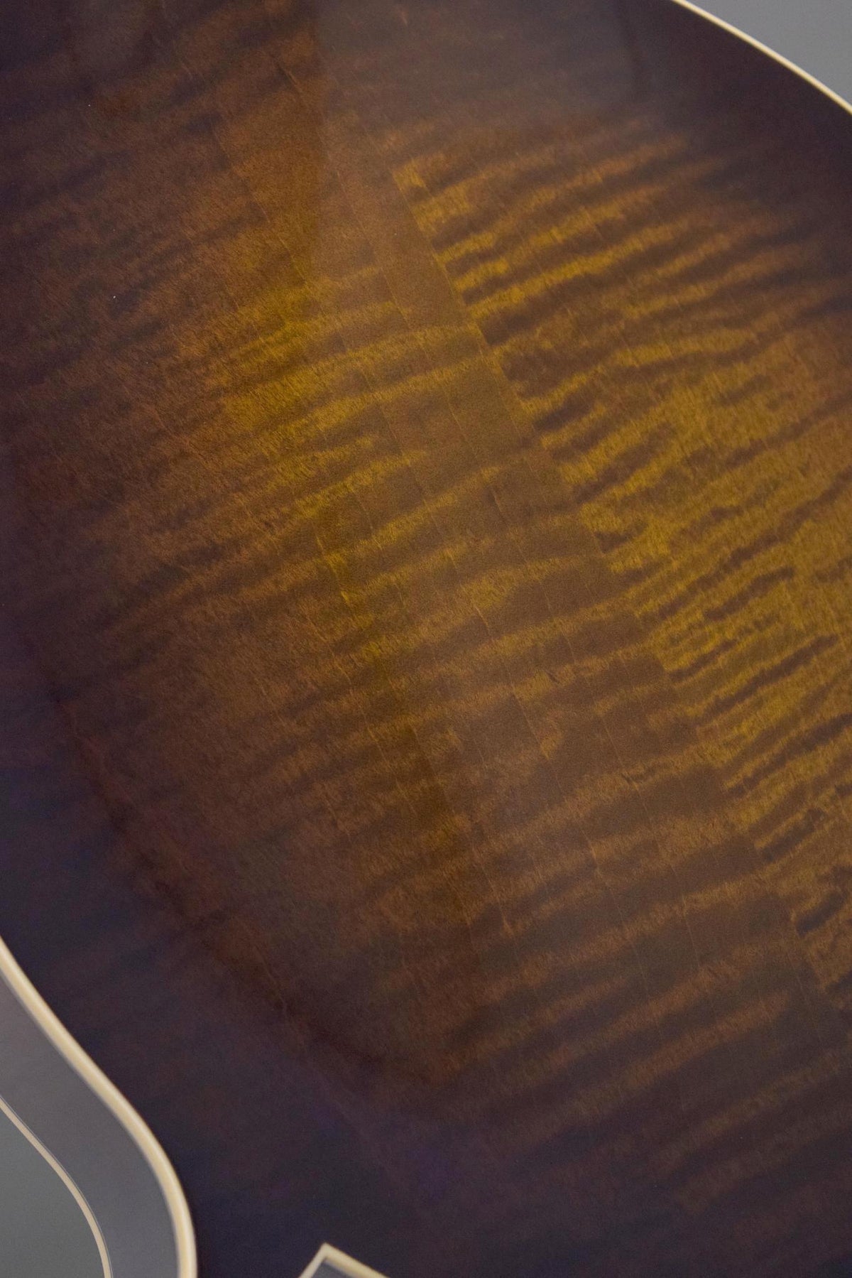 Close-up of the flame maple figure on the Big Mon mandolin's back