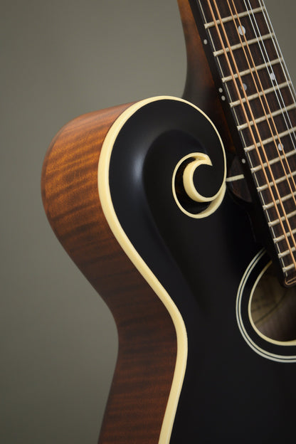 Carved scroll and ivoroid binding on the black-top Northfield F2S mandolin