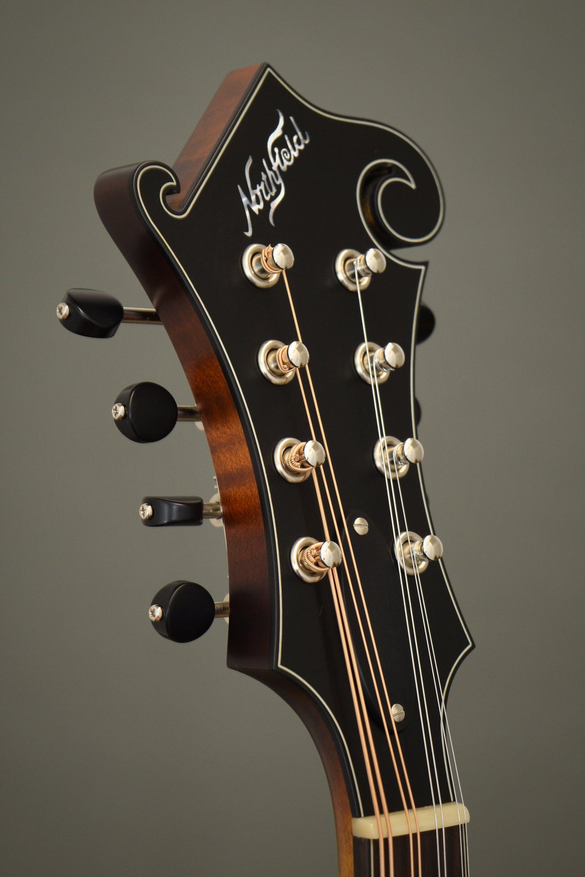 Headstock of the Northfield F2S mandolin with the Northfield logo