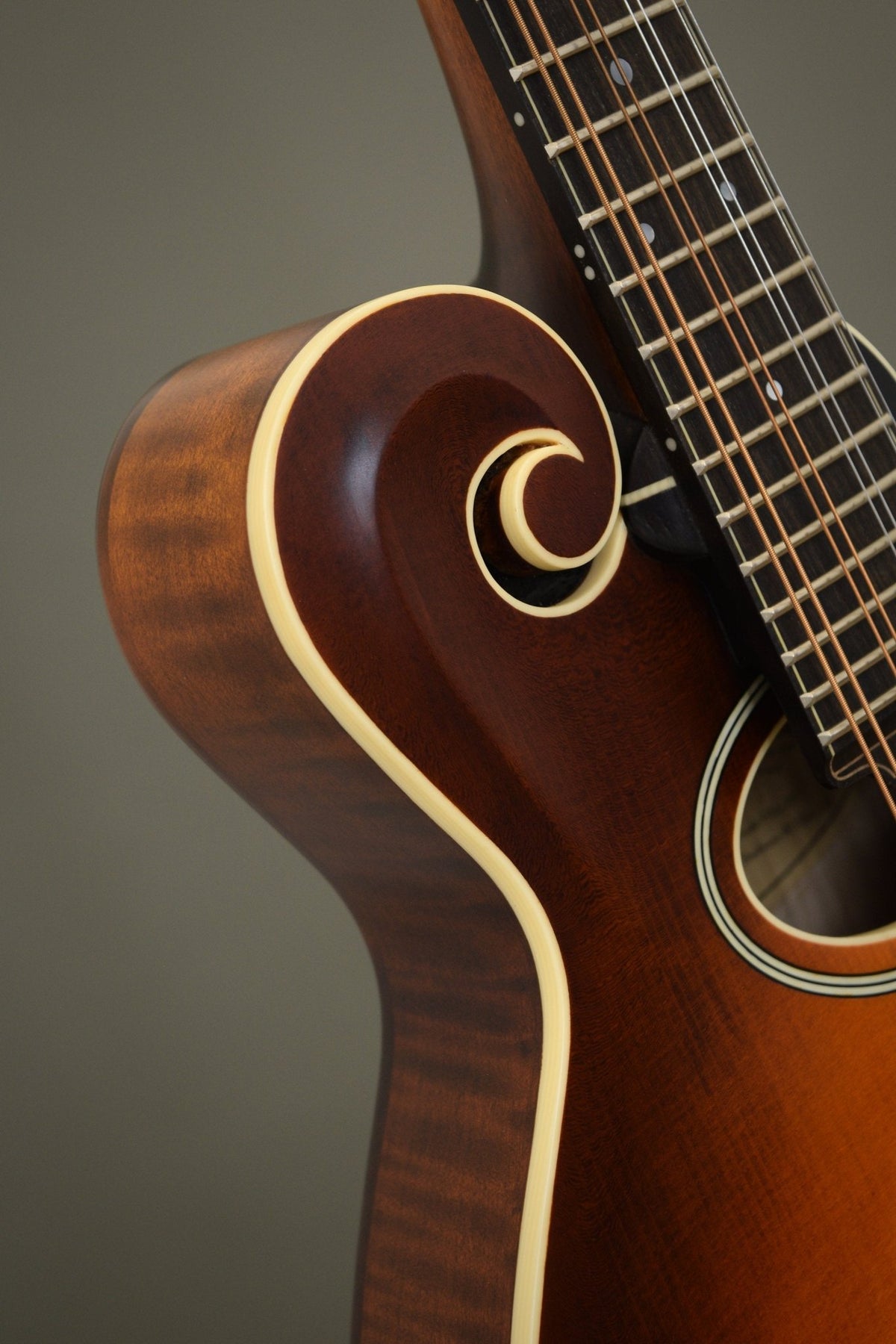 Carved scroll and ivoroid binding on the Northfield F2S mandolin