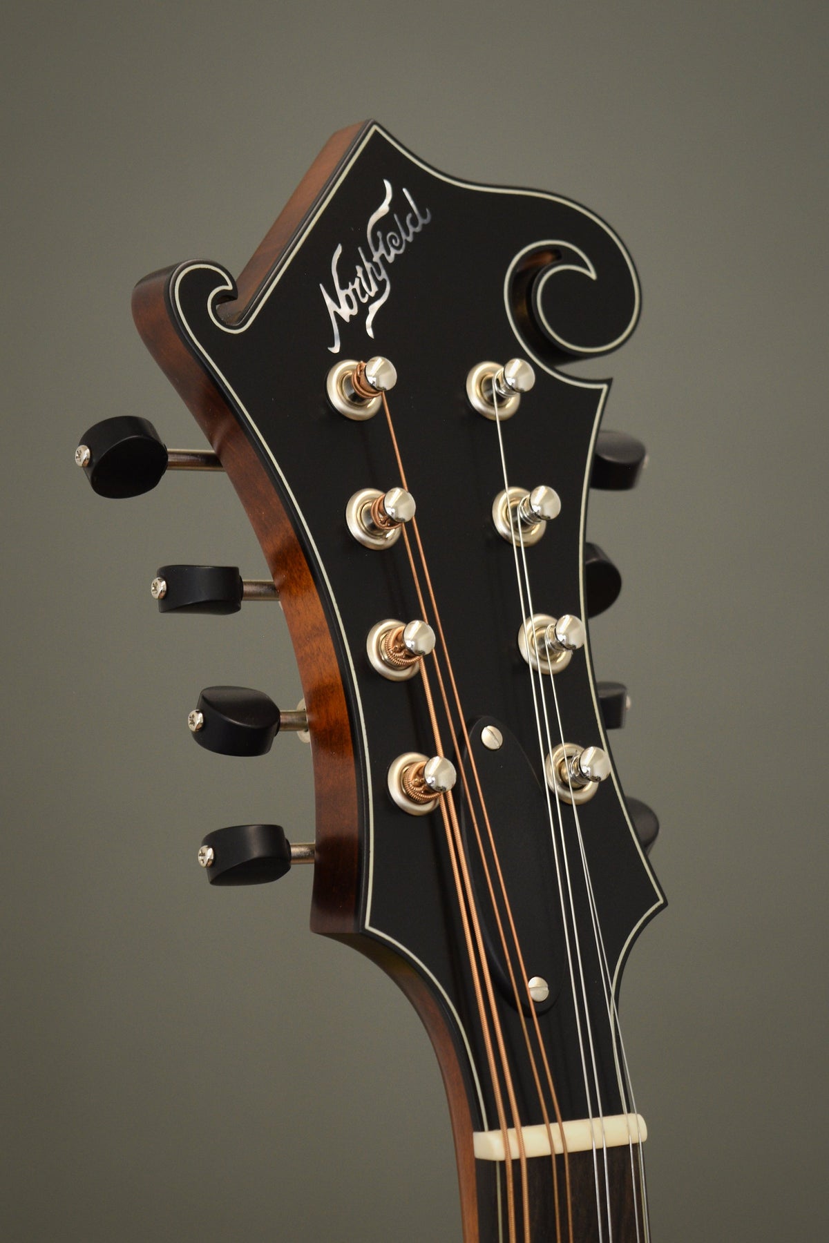 Headstock of the Northfield F2S mandolin with the Northfield logo