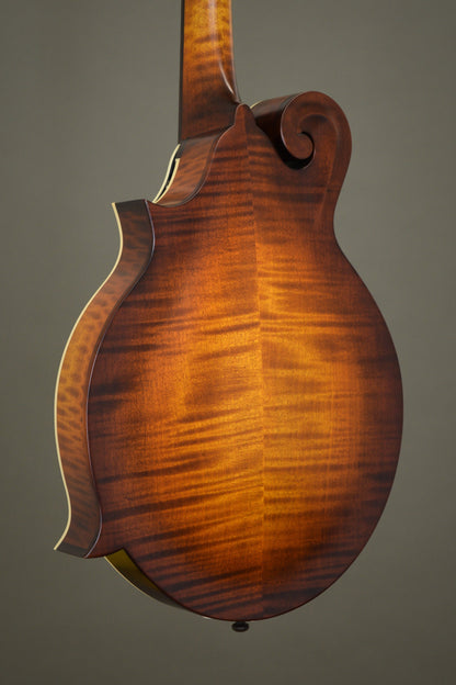 Flame maple back of the F2S oval hole mandolin, angled view