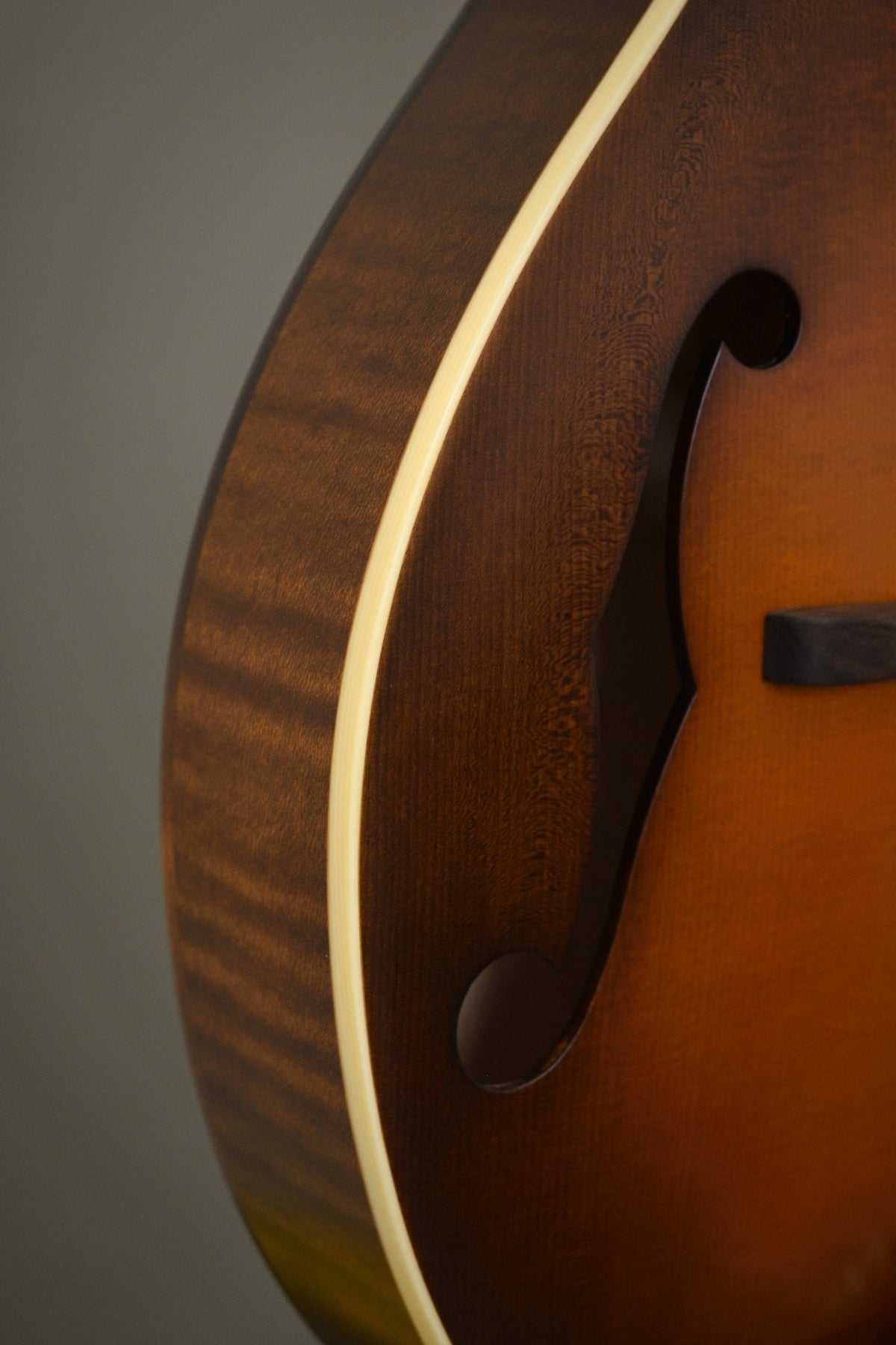 Flame maple rim and f-hole detail on the F5S mandolin's lower bout