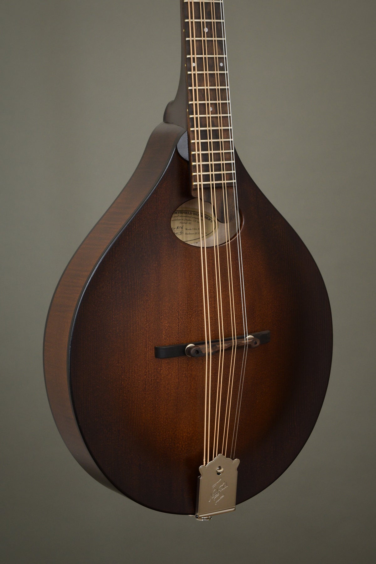 Northfield Wavelength oval hole octave mandolin in Dark Leatherburst, angled front view