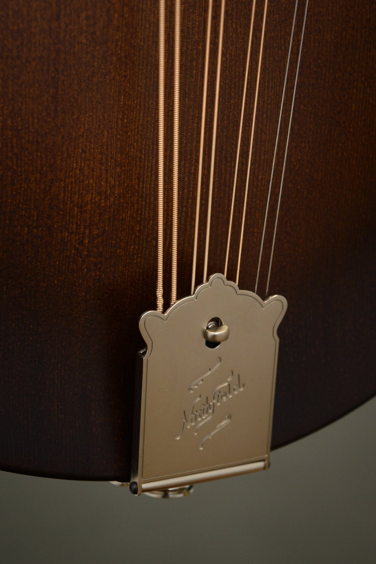 Engraved Northfield tailpiece and the K&K pickup endpin jack on the Wavelength octave mandolin